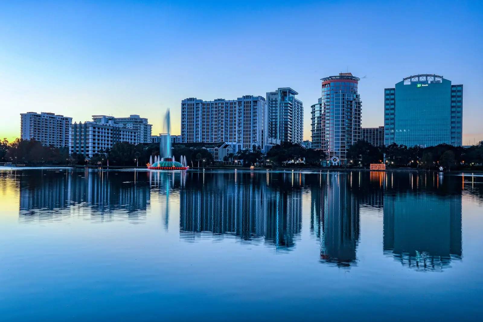 The Orlando skyline reflected in Lake Eola at dusk