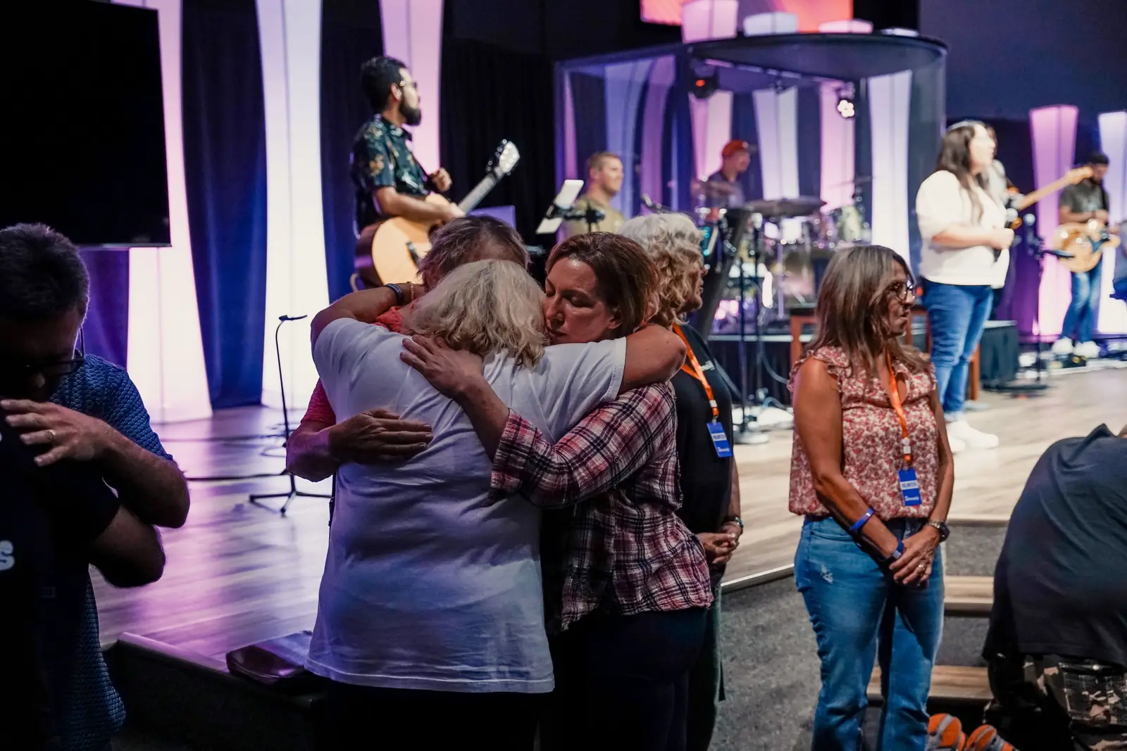 Women embracing during worship